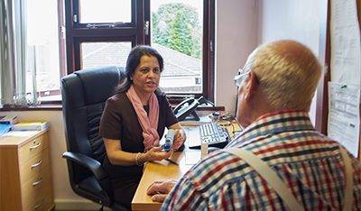 Image of a consultant speaking to a patient