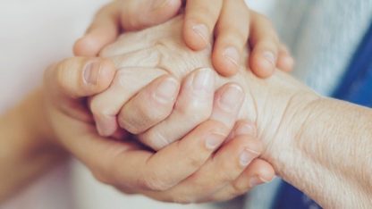 Image of hands being held