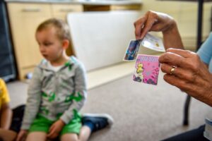 Photograph of child and 'brave patient' sticker