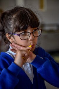 Photograph of child brushing teeth