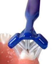 Image of a triple headed toothbrush