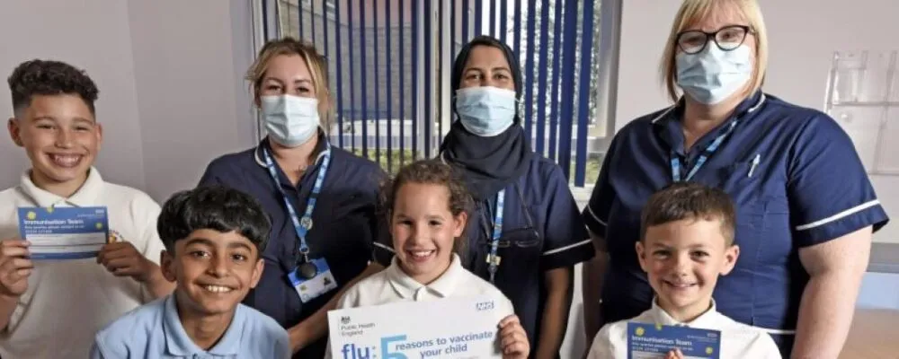 Photograph of Bradford School Immunisation team and children who have been vaccinated